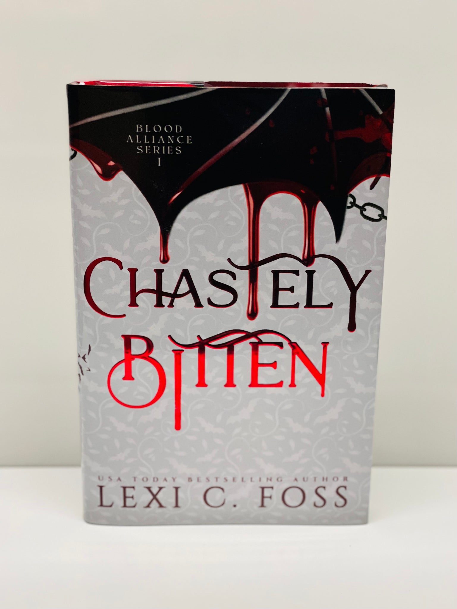 Chastely Bitten- Hardcover- Foiled with No Edging (Blood Alliance: Book 1)